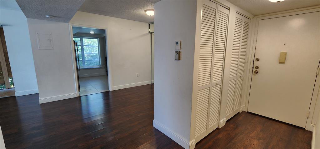 4168 Inverrary Drive, Unit 401 Lauderhill, FL 33319 - Photo 3 of 22 an empty room with wooden floor and windows