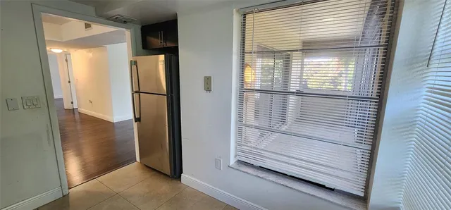 a view of wooden floor and a cabinet