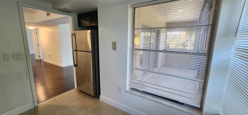 4168 Inverrary Drive, Unit 401 Lauderhill, FL 33319 - Photo 6 of 22 a view of wooden floor and a cabinet