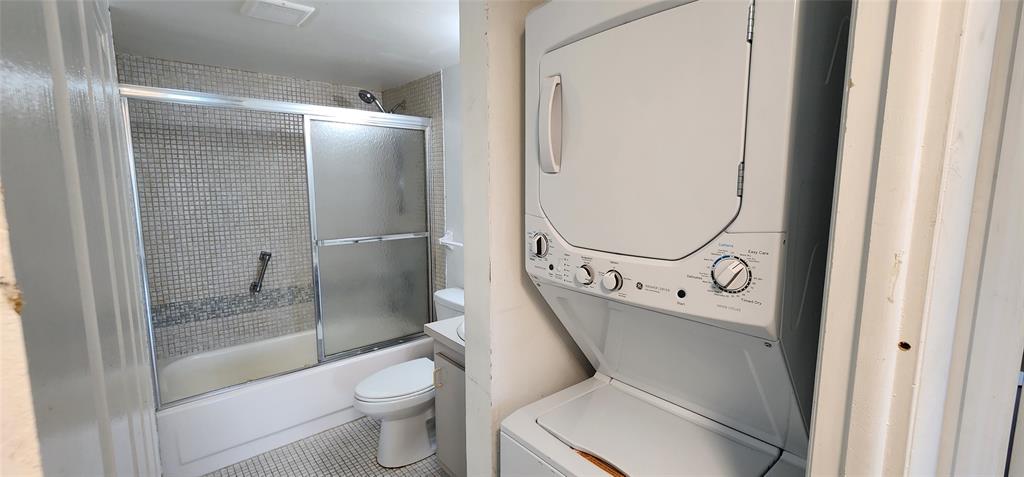 4168 Inverrary Drive, Unit 401 Lauderhill, FL 33319 - Photo 9 of 22 a bathroom with a granite countertop toilet sink and shower