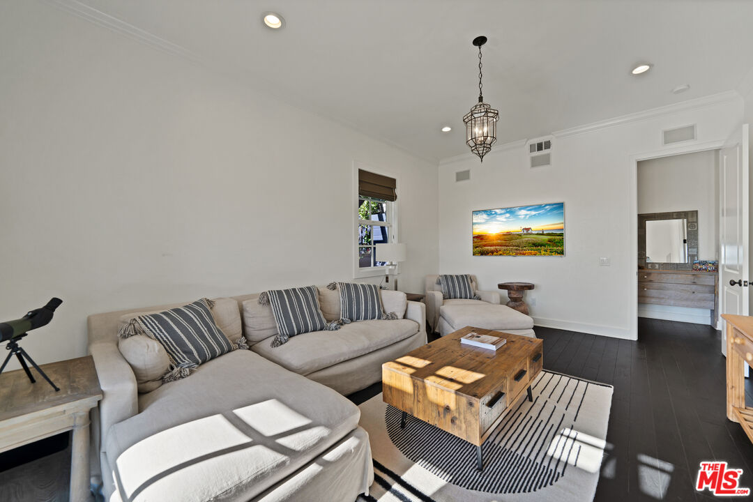 28850 Hampton Place Malibu, CA 90265 - Photo 15 of 58 a living room with furniture a ceiling fan and a rug