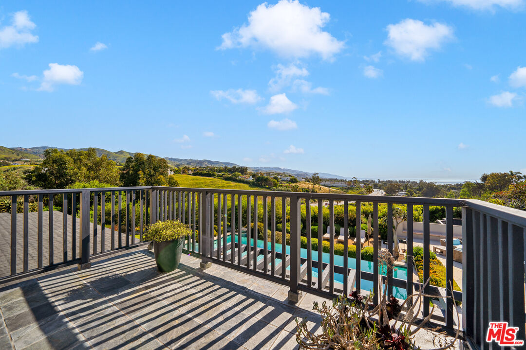 28850 Hampton Place Malibu, CA 90265 - Photo 22 of 58 a balcony with wooden floor