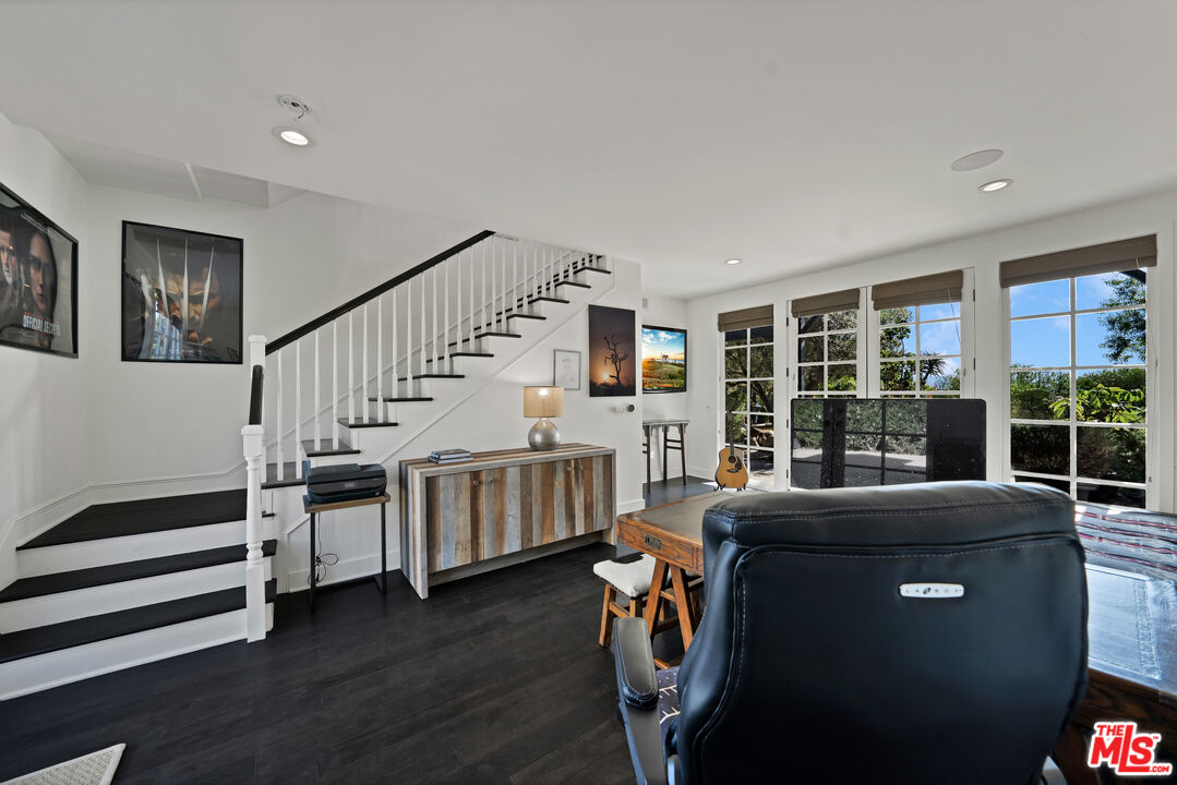 28850 Hampton Place Malibu, CA 90265 - Photo 28 of 58 a living room with furniture and a floor to ceiling window