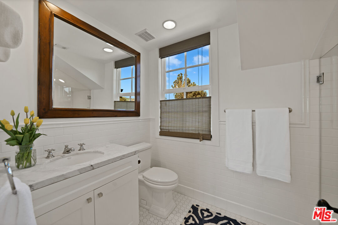 28850 Hampton Place Malibu, CA 90265 - Photo 30 of 58 a bathroom with a toilet sink and mirror