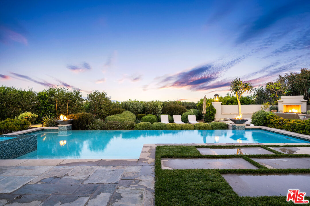 28850 Hampton Place Malibu, CA 90265 - Photo 36 of 58 a view of a swimming pool with a patio