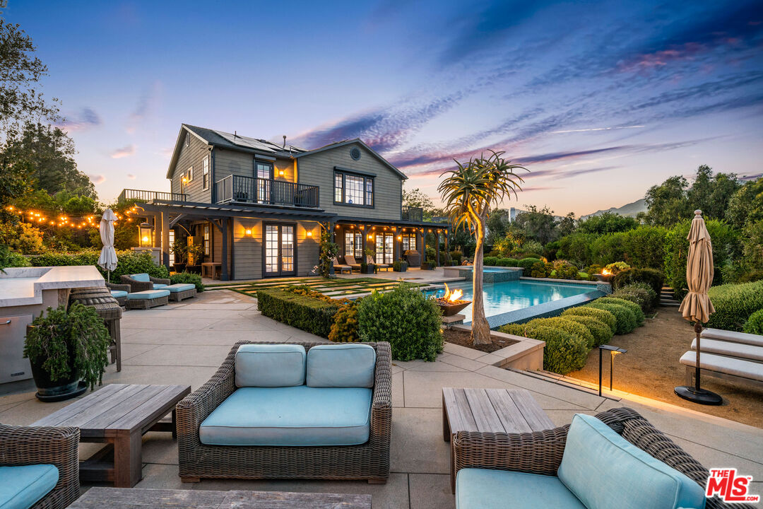 28850 Hampton Place Malibu, CA 90265 - Photo 39 of 58 a view of a patio with couches chairs and a fire pit