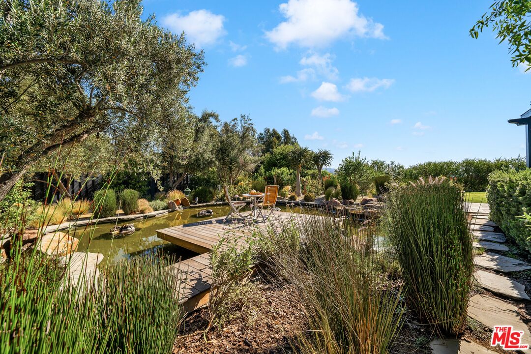 28850 Hampton Place Malibu, CA 90265 - Photo 44 of 58 a view of swimming pool with outdoor seating and plants
