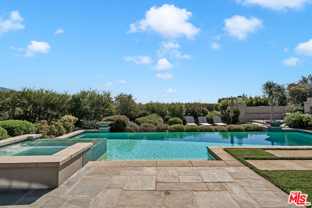 28850 Hampton Place Malibu, CA 90265 - Photo 48 of 58 a view of a swimming pool with a yard