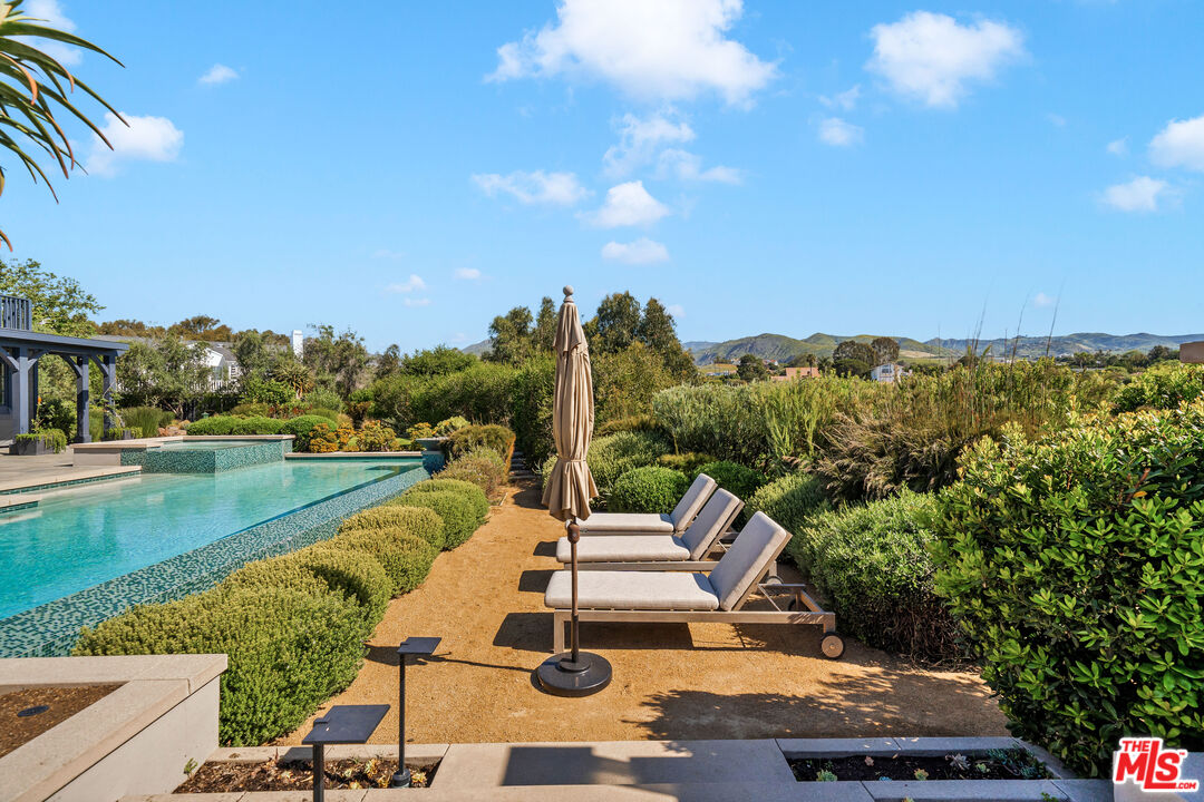 28850 Hampton Place Malibu, CA 90265 - Photo 52 of 58 a view of a swimming pool and lake view