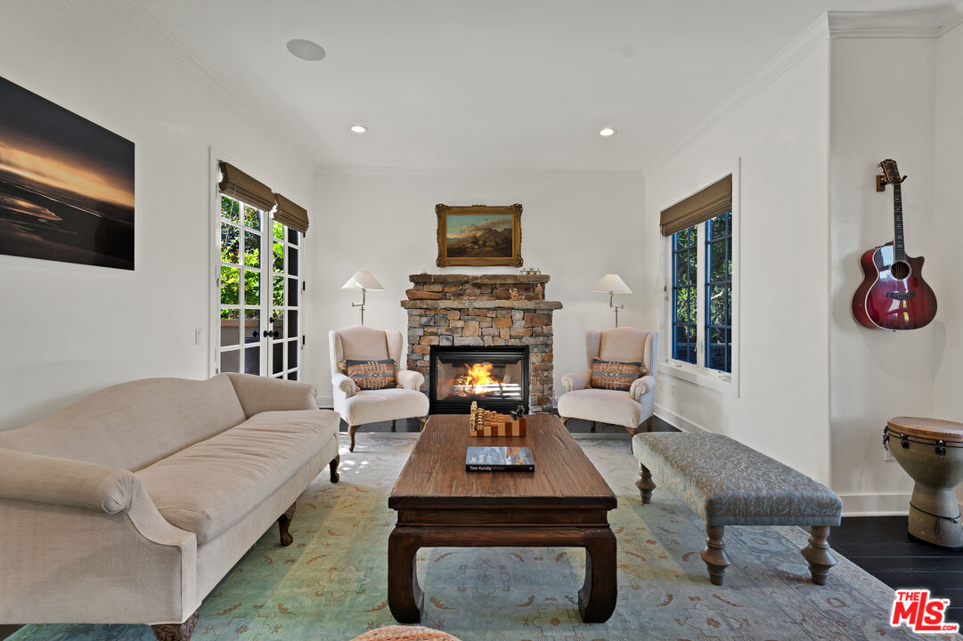 28850 Hampton Place Malibu, CA 90265 - Photo 8 of 58 a living room with furniture and a fireplace