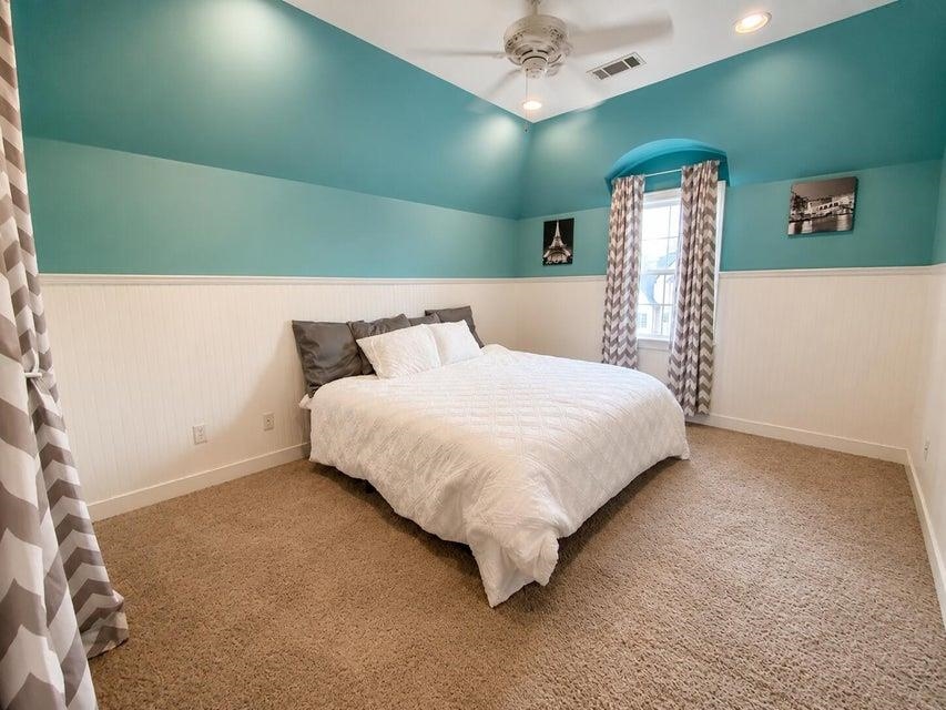 295 North Ridge Drive Saltillo, MS 38866 - Photo 28 of 38 a bedroom with a bed and a chandelier