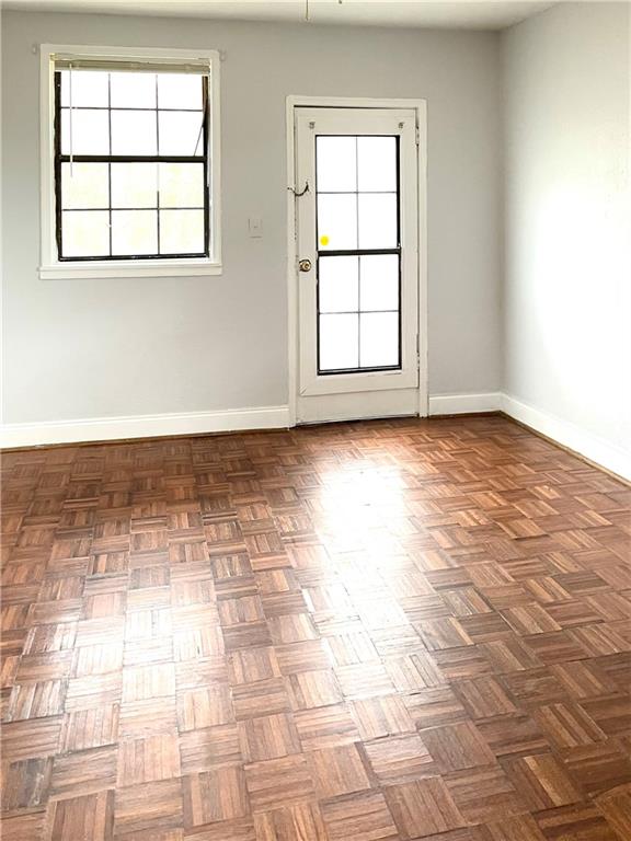 1443 Oxford Road Northeast, Unit 2 Atlanta, GA 30307 - Photo 1 of 9 an empty room with windows