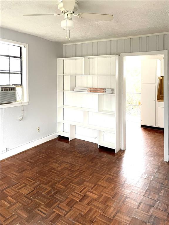 1443 Oxford Road Northeast, Unit 2 Atlanta, GA 30307 - Photo 3 of 9 a view of empty room with wooden floor and fan