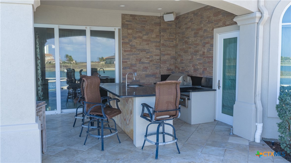 153 Tuscany Way Port O'Connor, TX 77982 - Photo 40 of 48 a view of a dining room with furniture window and outside view