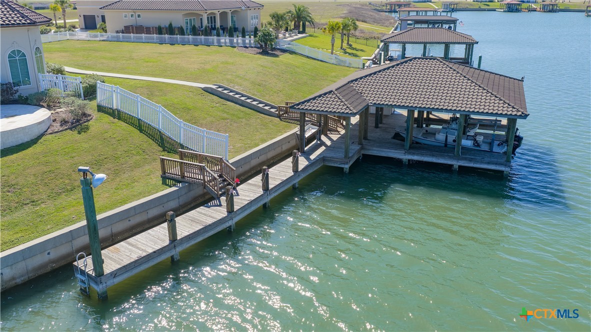 153 Tuscany Way Port O'Connor, TX 77982 - Photo 44 of 48 a view of a house with pool and chairs