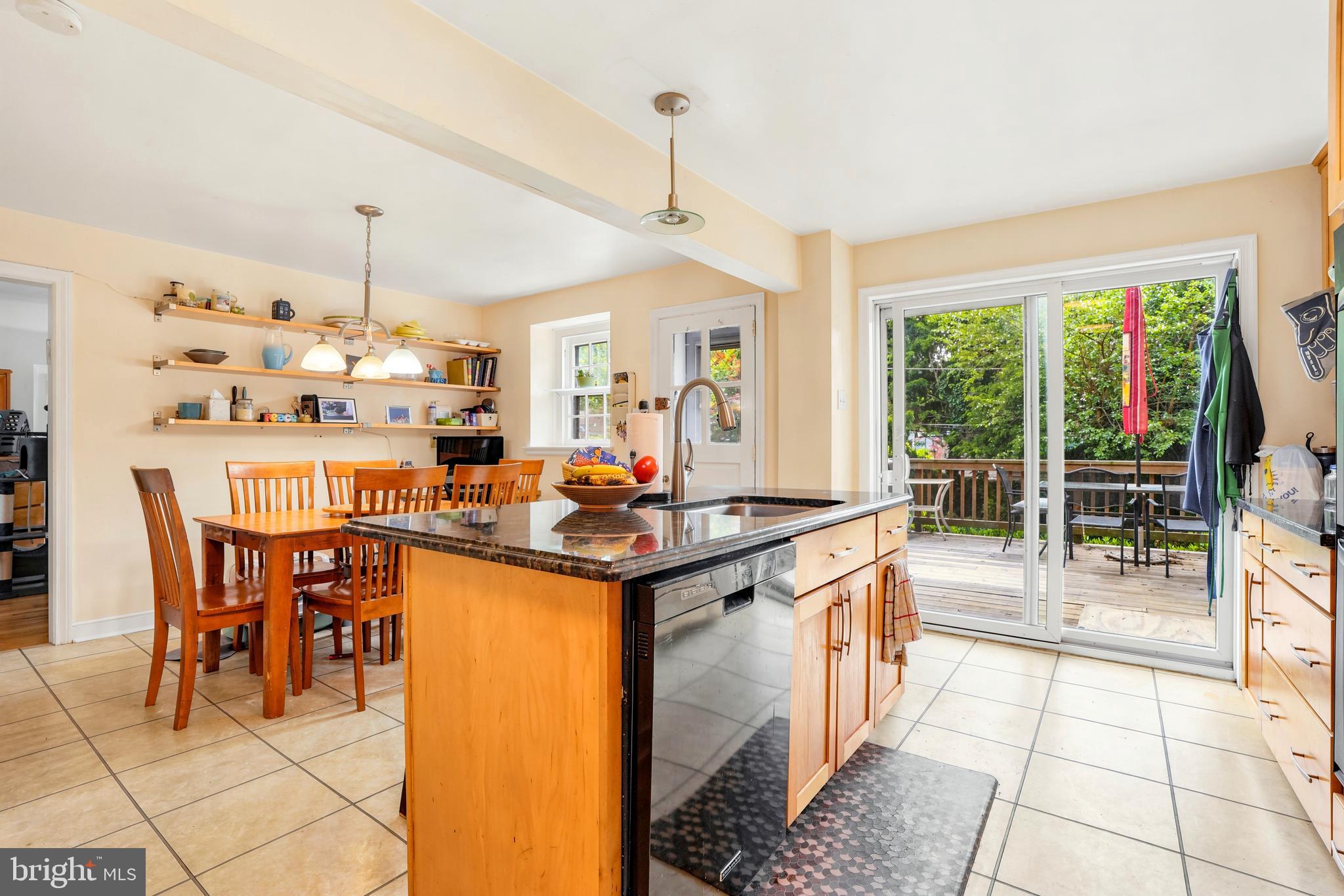 284 Trent Road Wynnewood, PA 19096 - Photo 4 of 31 a kitchen with stainless steel appliances a stove a sink a dining table and chairs