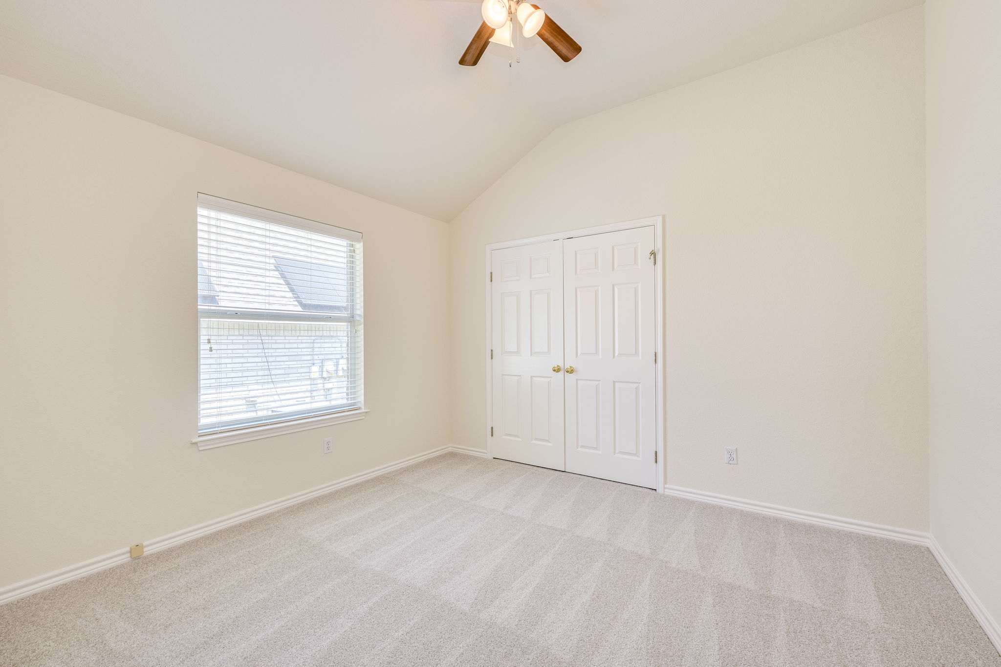 111 Arrowhead Lane Georgetown, TX 78628 - Photo 34 of 40 an empty room with a ceiling fan and window