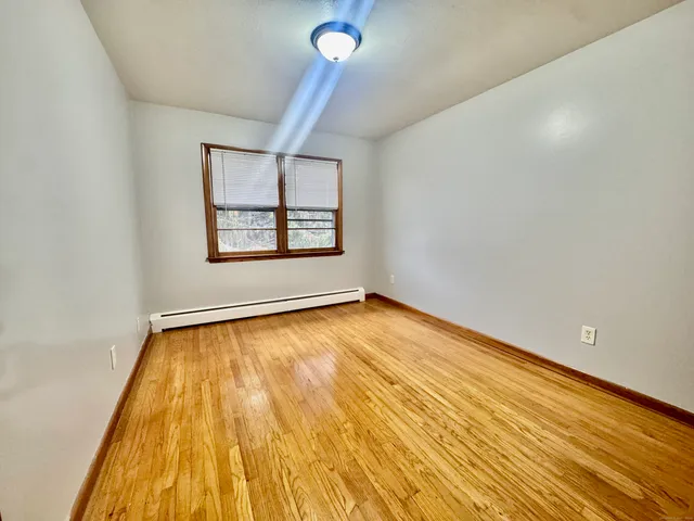 a view of an empty room and window