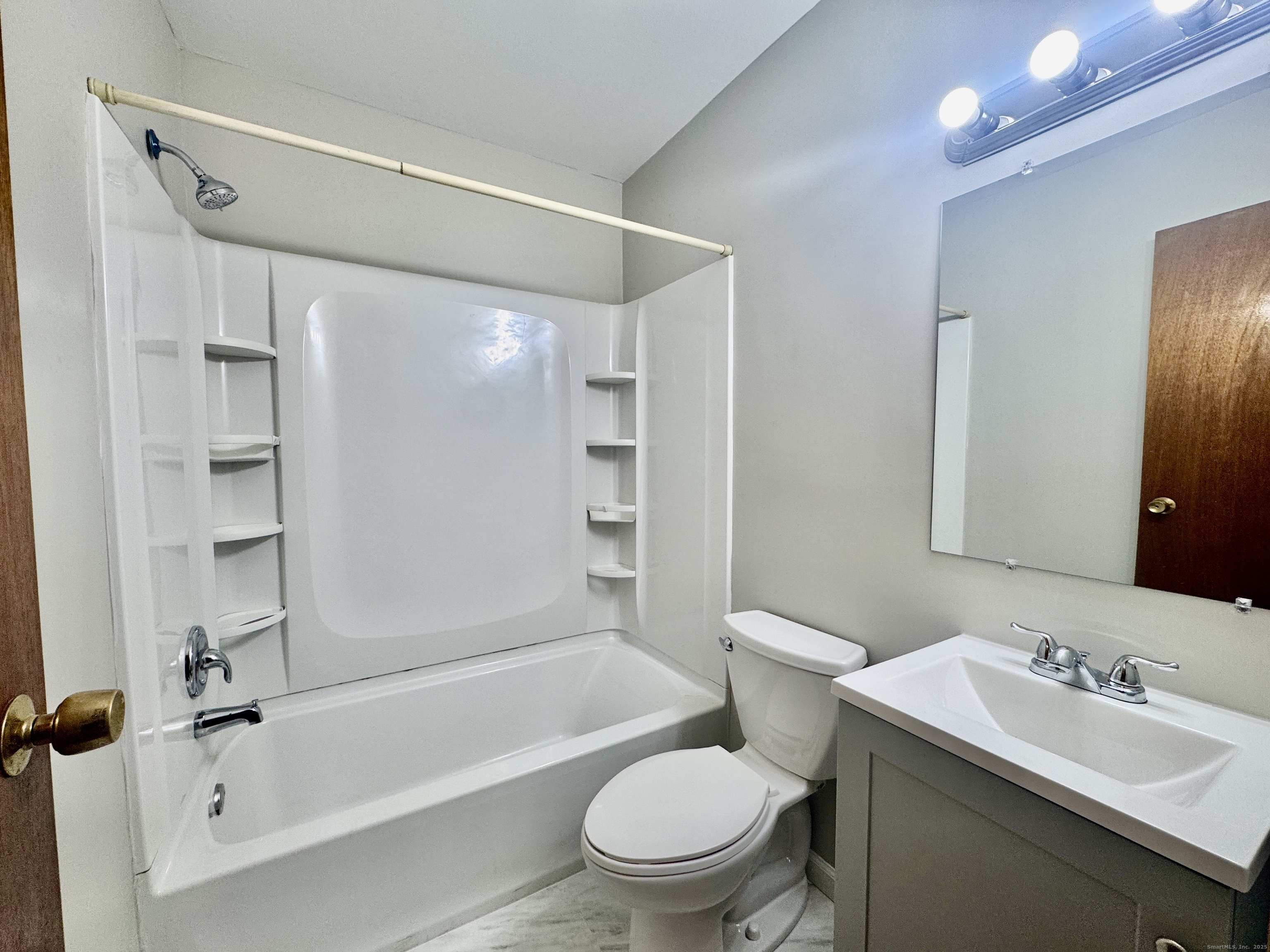 197 Potuccos Ring Road, Unit 5 Wolcott, CT 06716 - Photo 15 of 19 a bathroom with a sink toilet and shower