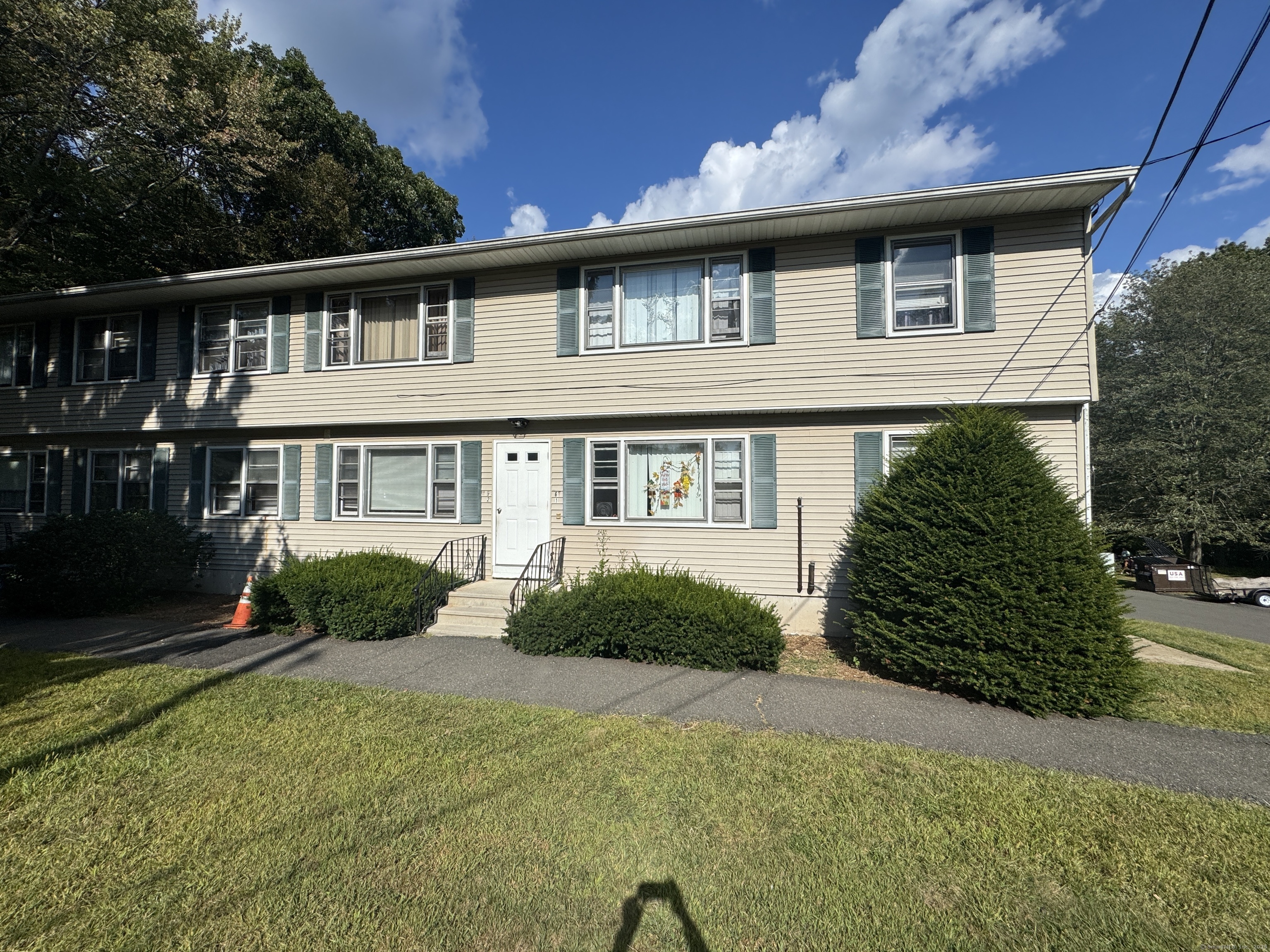 197 Potuccos Ring Road, Unit 5 Wolcott, CT 06716 - Photo 16 of 19 a front view of a house with a yard