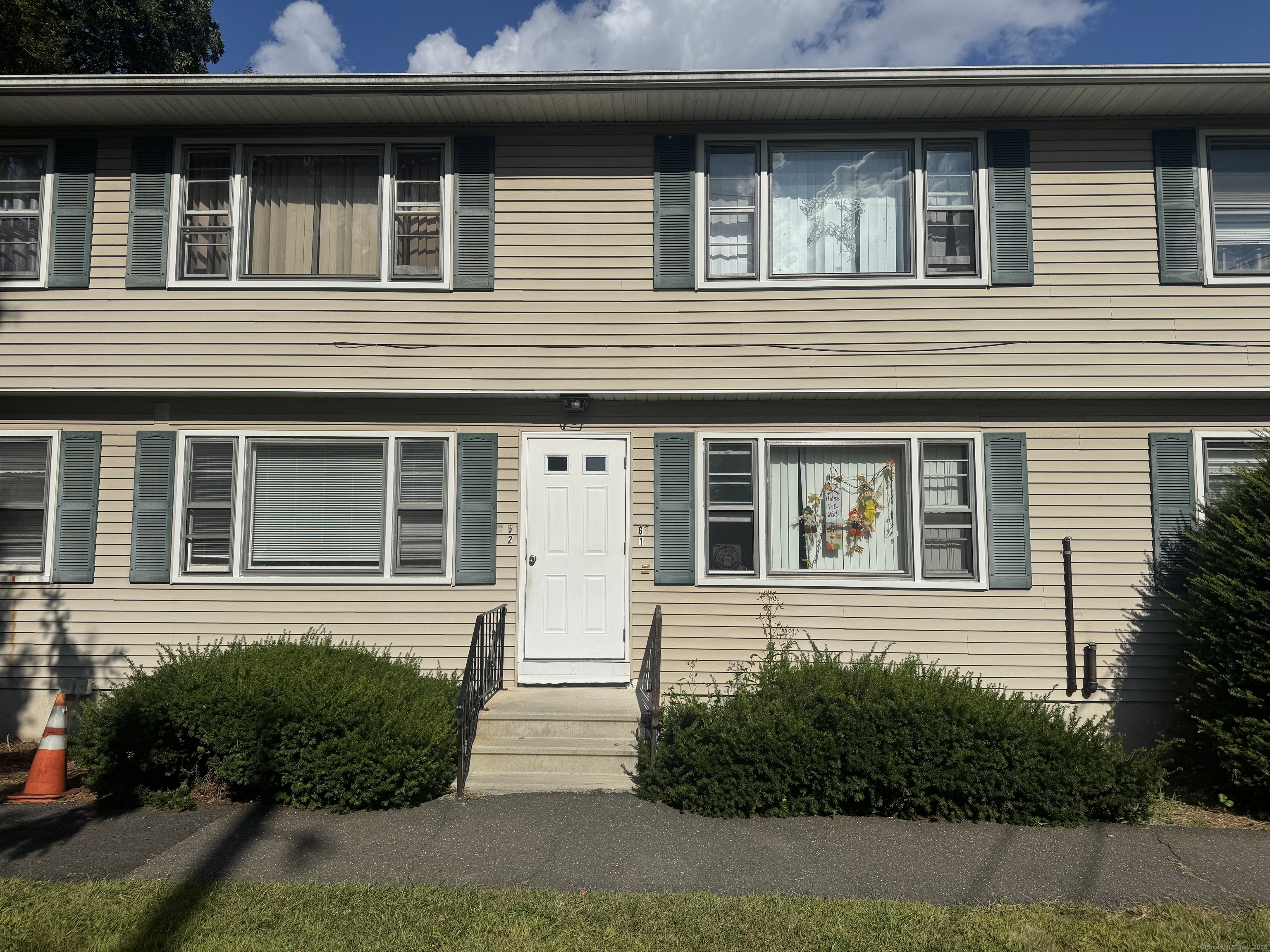 197 Potuccos Ring Road, Unit 5 Wolcott, CT 06716 - Photo 19 of 19 a view of a house with a window and potted plants
