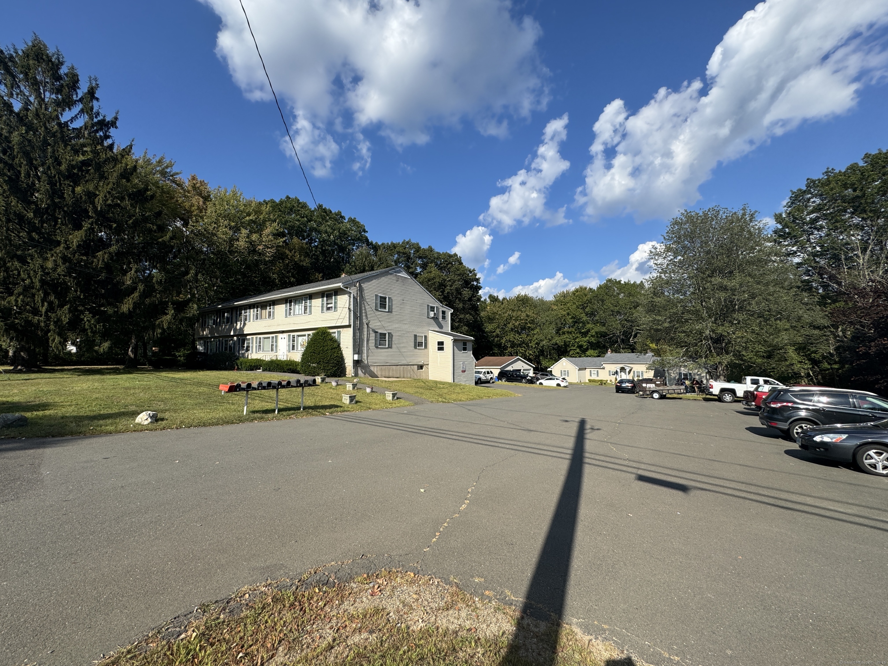 197 Potuccos Ring Road, Unit 5 Wolcott, CT 06716 - Photo 2 of 19 a view of street with parked cars