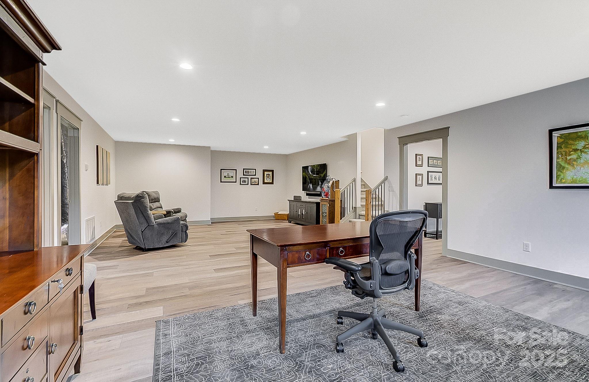 250 Judson Ridge Road Arden, NC 28704 - Photo 13 of 47 a work room with furniture a rug and a window