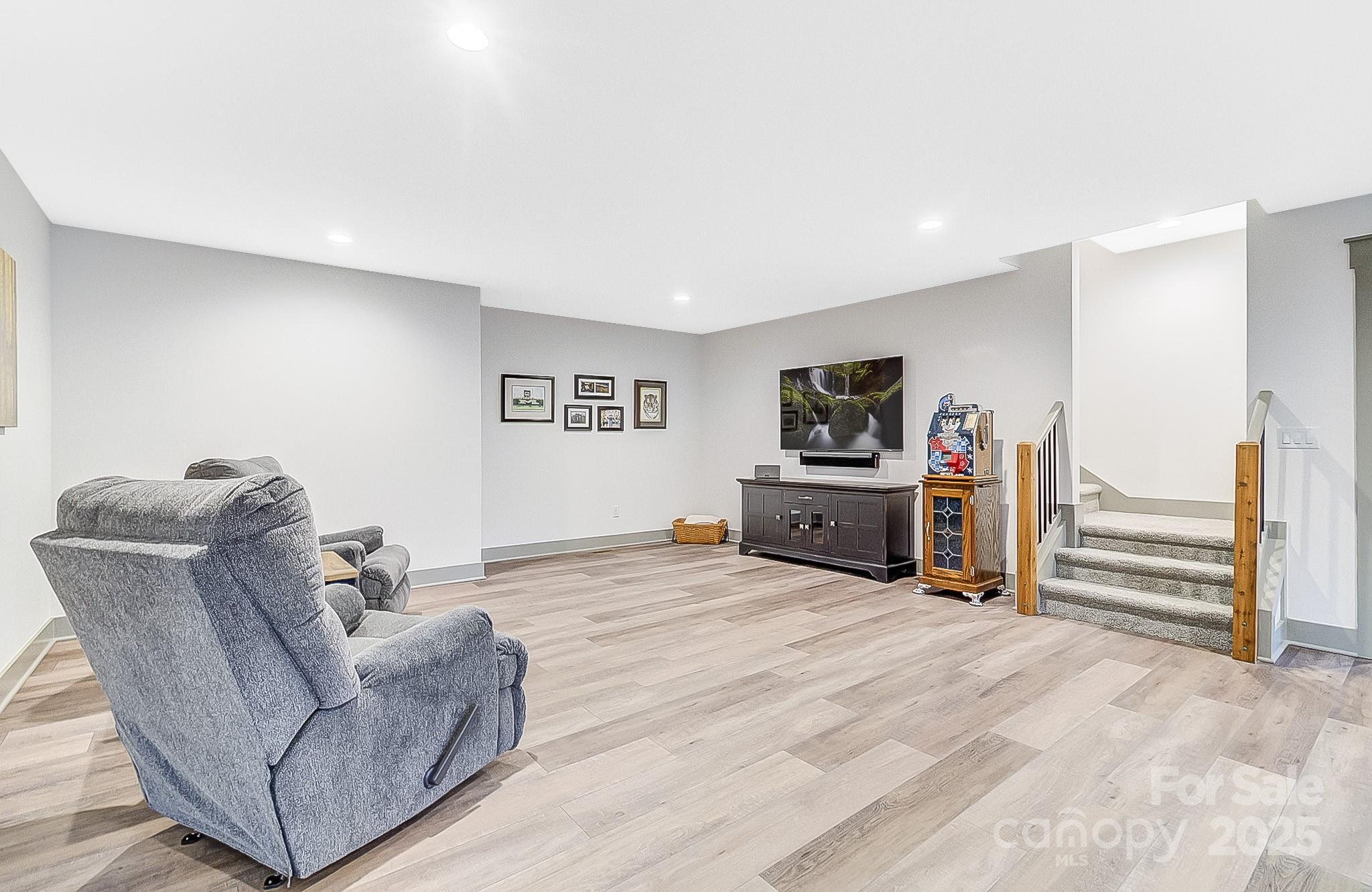 250 Judson Ridge Road Arden, NC 28704 - Photo 14 of 47 a living room with furniture and a flat screen tv