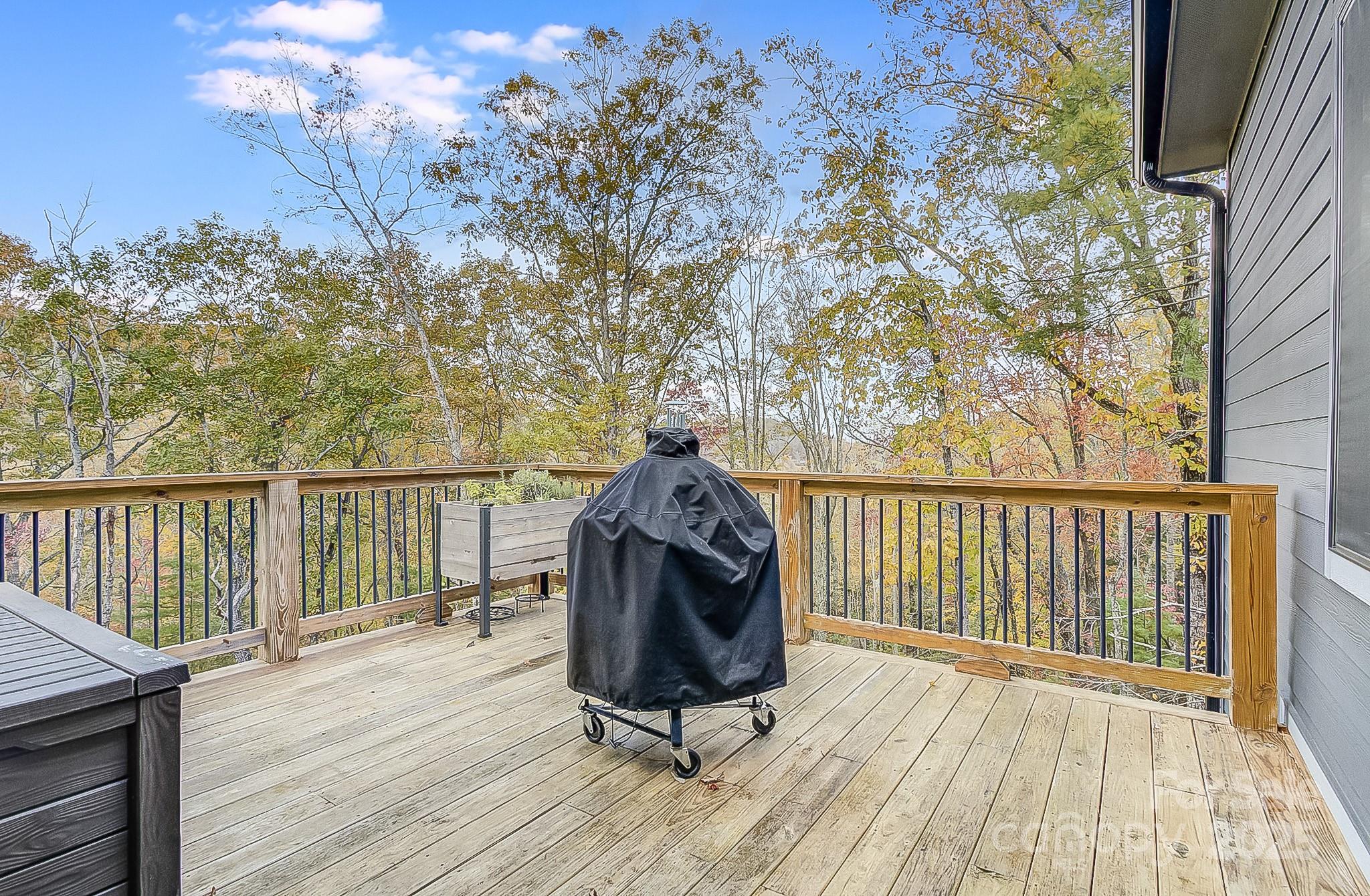 250 Judson Ridge Road Arden, NC 28704 - Photo 20 of 47 a view of roof deck with wooden floor and fence