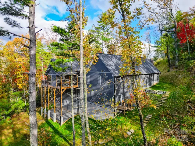 a aerial view of a house with a yard