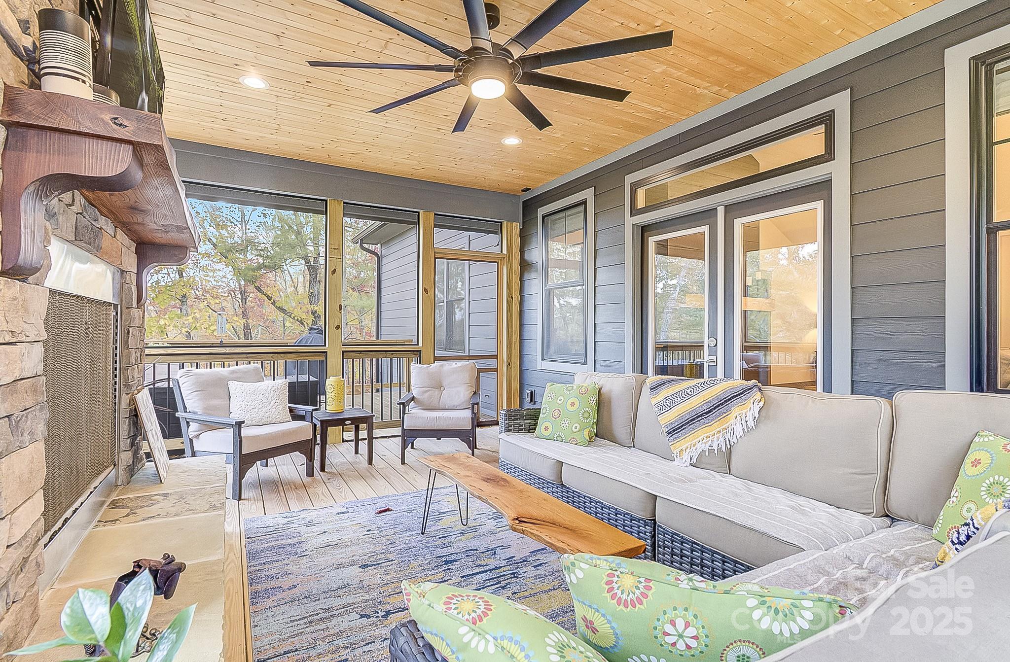 250 Judson Ridge Road Arden, NC 28704 - Photo 27 of 47 a living room with furniture and a large window