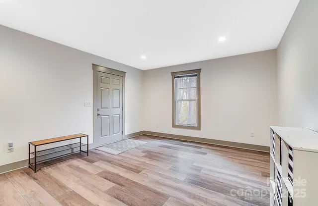 a view of a livingroom with furniture and wooden floor