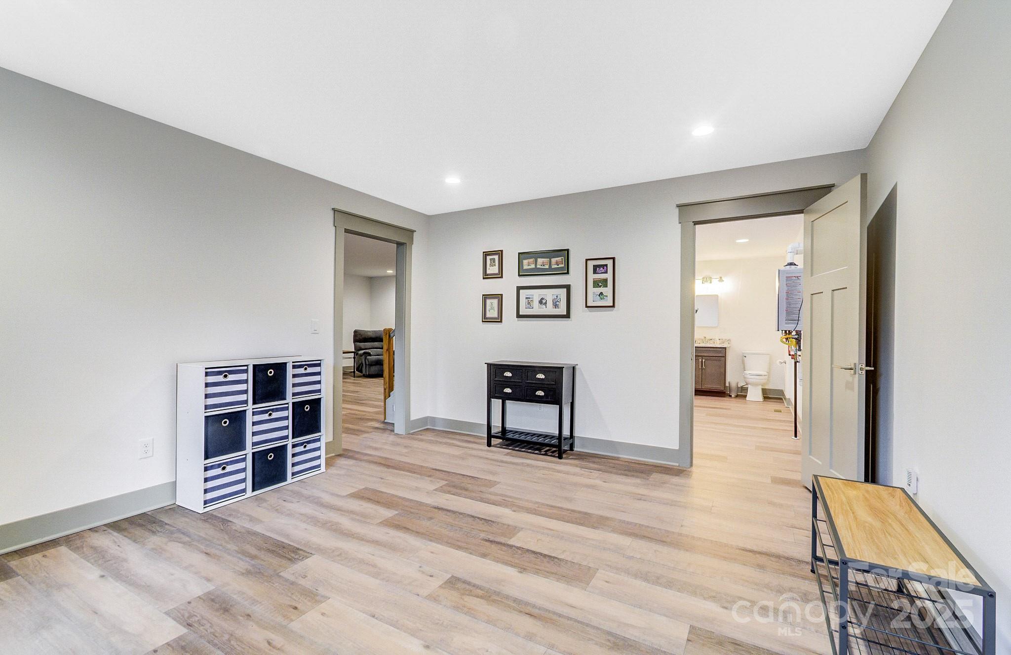 250 Judson Ridge Road Arden, NC 28704 - Photo 29 of 47 a view of a livingroom with furniture and wooden floor
