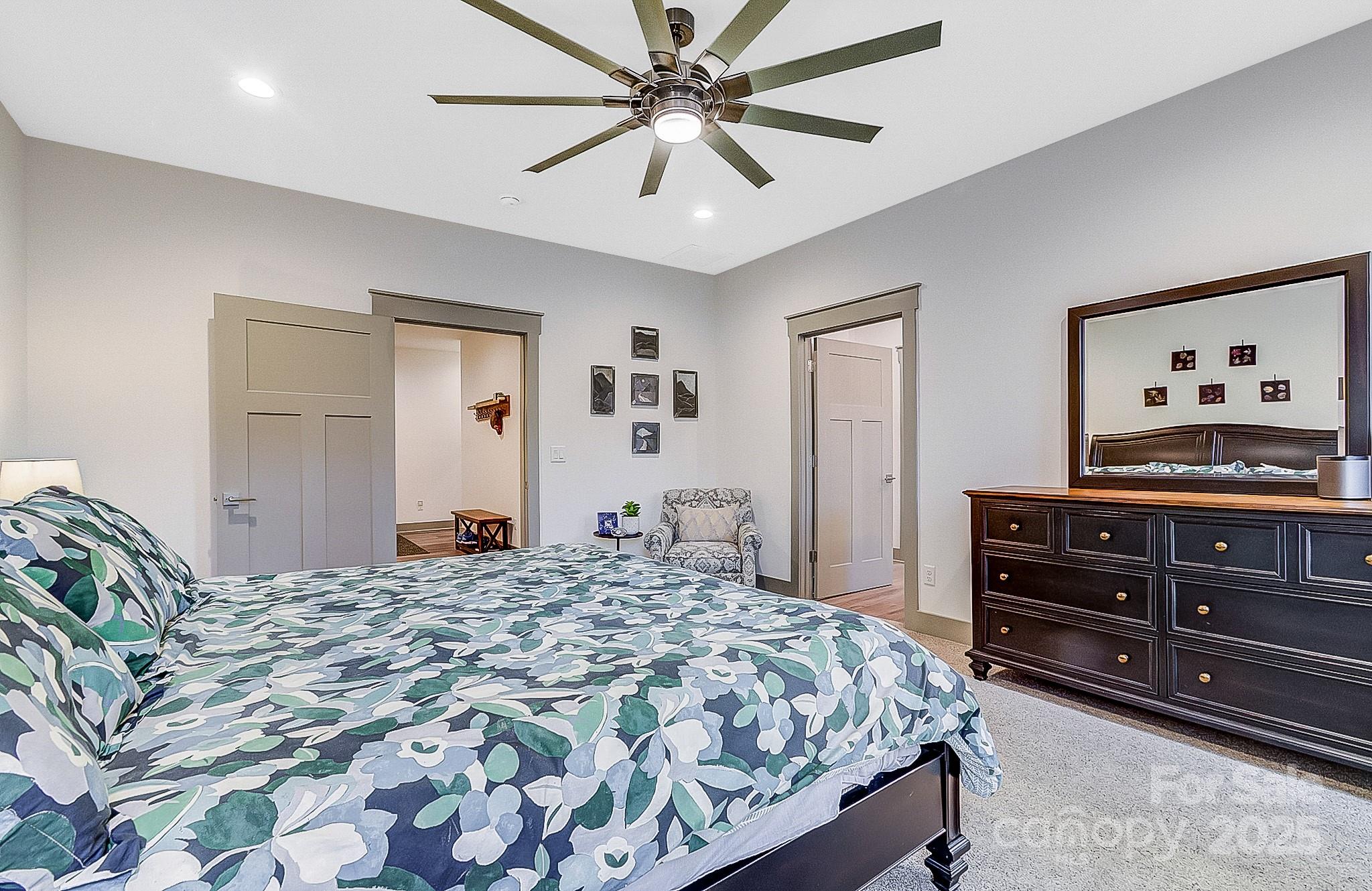 250 Judson Ridge Road Arden, NC 28704 - Photo 30 of 47 a bedroom with a bed and a dresser