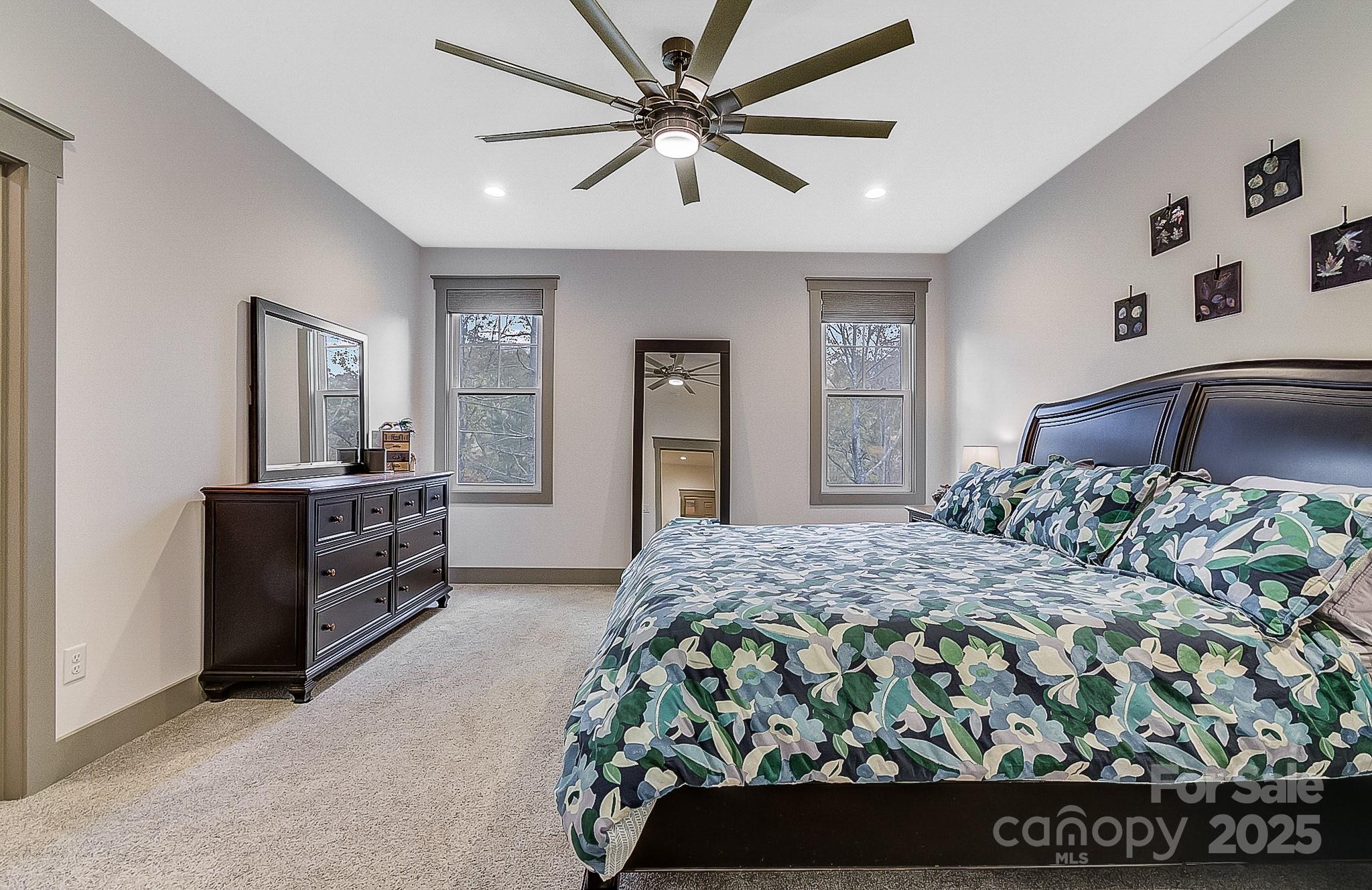 250 Judson Ridge Road Arden, NC 28704 - Photo 32 of 47 a bedroom with a large bed and a dresser