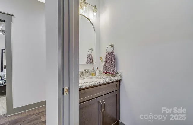 a spacious kitchen with stainless steel appliances granite countertop a sink and a stove