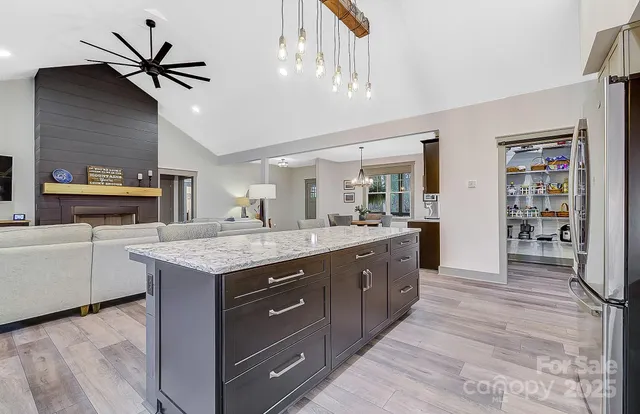 a kitchen with lots of bottles of alcohol