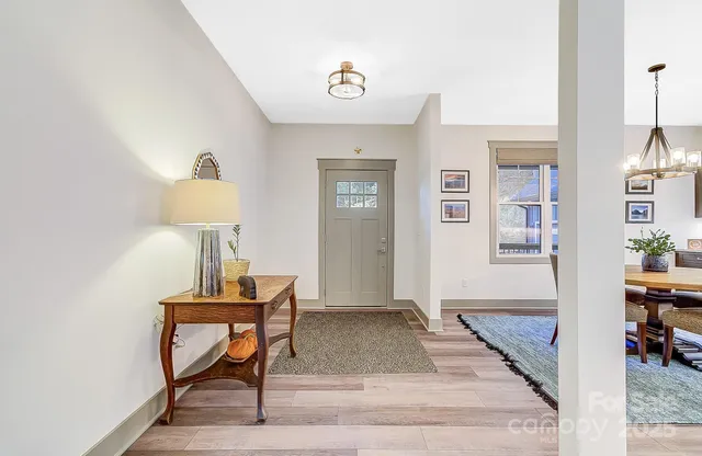 a view of a livingroom with furniture and wooden floor