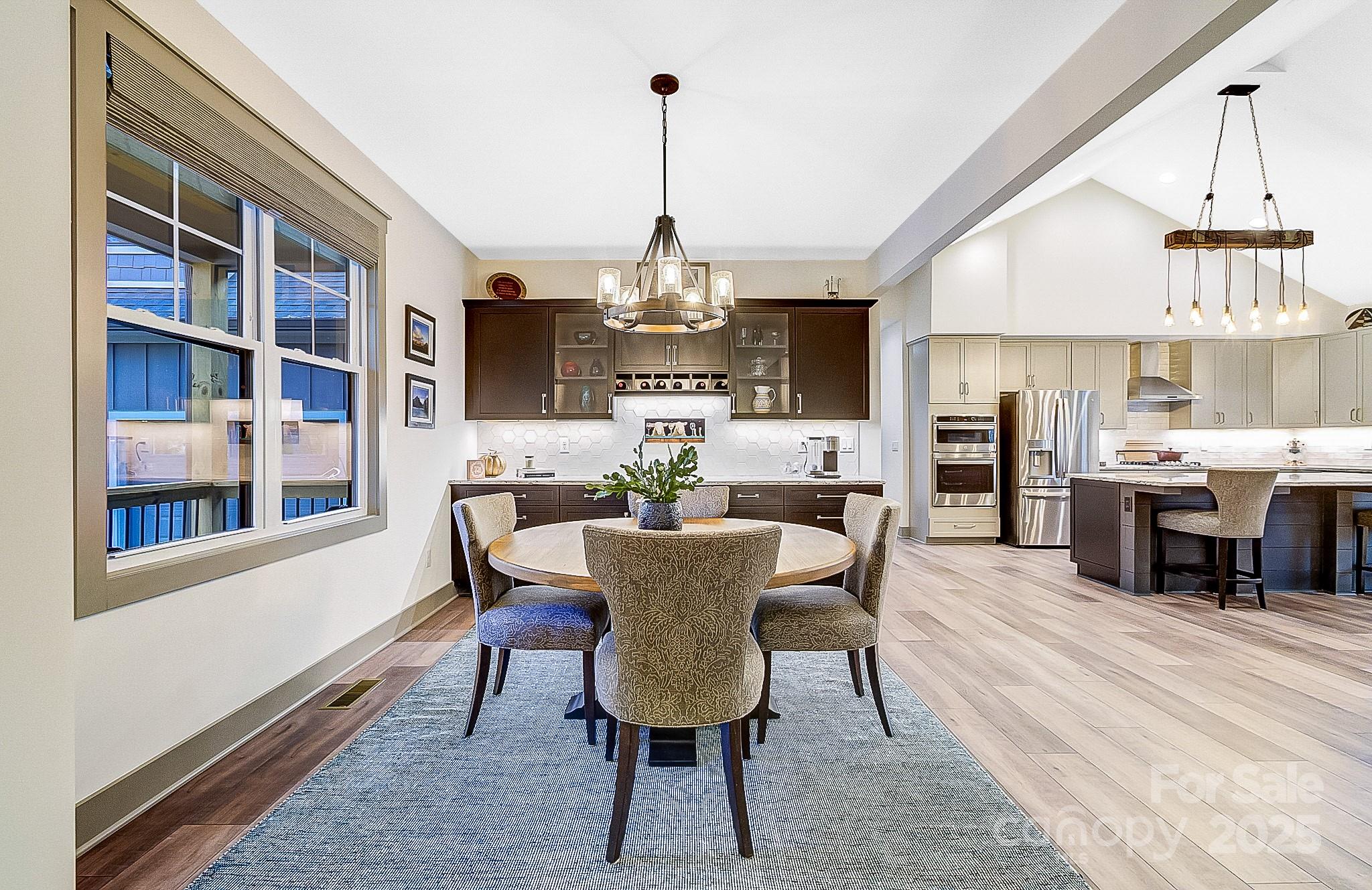 250 Judson Ridge Road Arden, NC 28704 - Photo 45 of 47 a view of a dining room with furniture window and wooden floor