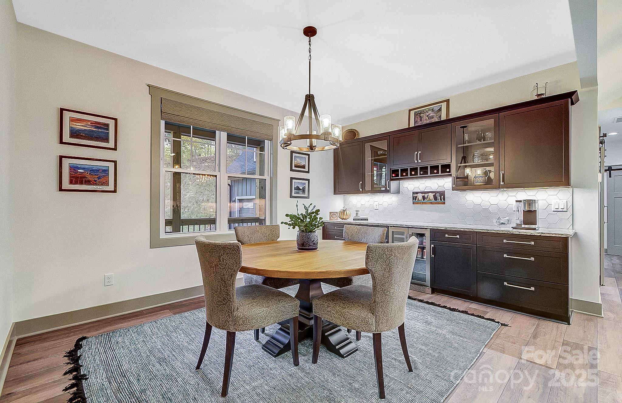 250 Judson Ridge Road Arden, NC 28704 - Photo 46 of 47 a view of a dining room with furniture window and wooden floor