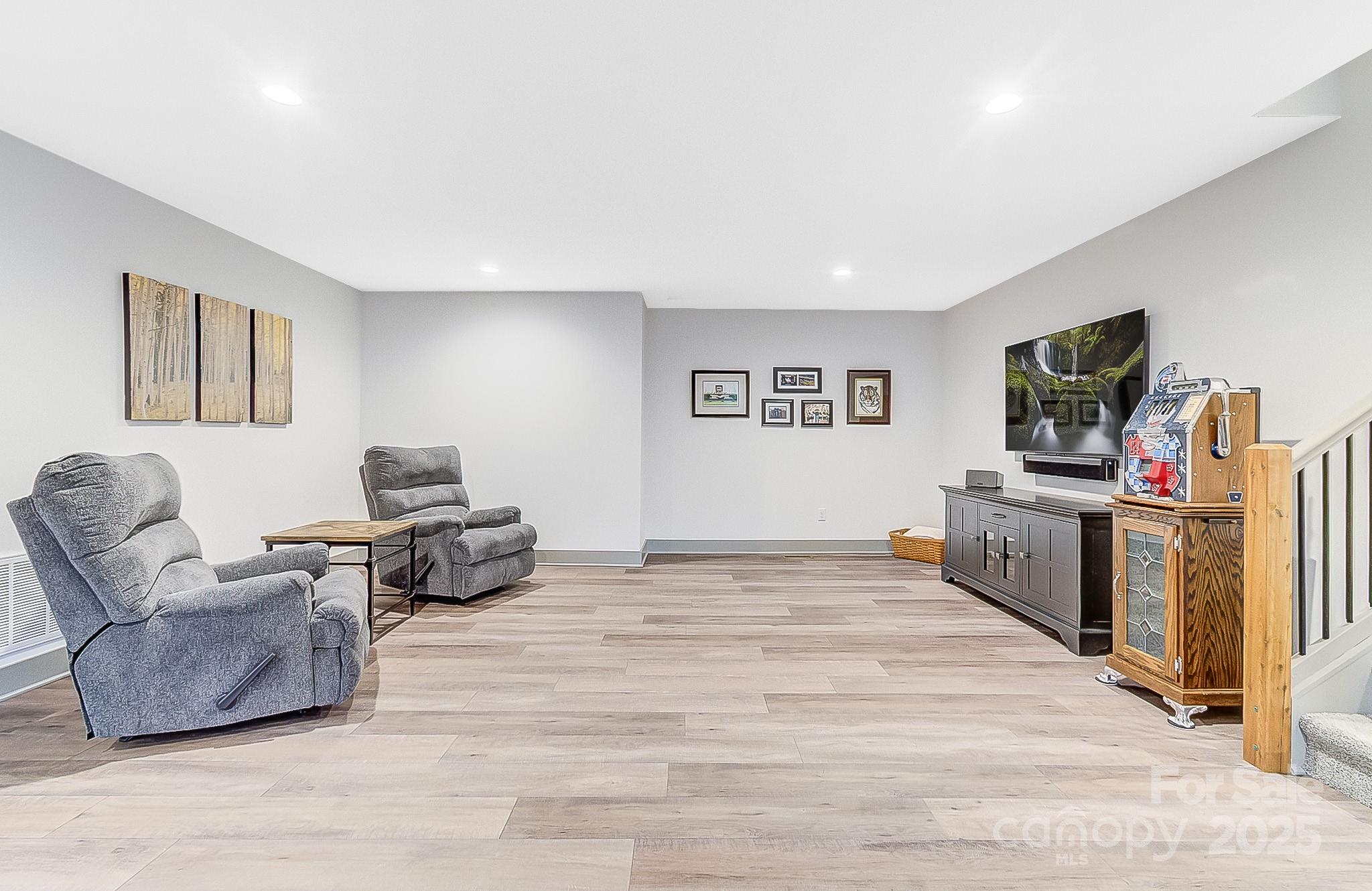 250 Judson Ridge Road Arden, NC 28704 - Photo 47 of 47 a living room with furniture and a flat screen tv
