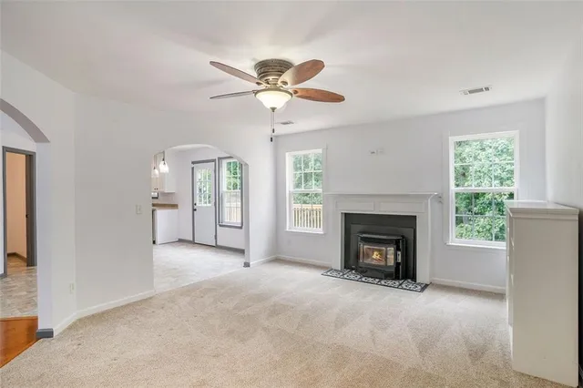 a view of a room with cabinet and ceiling fan