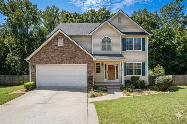 a view of a yard in front view of a house