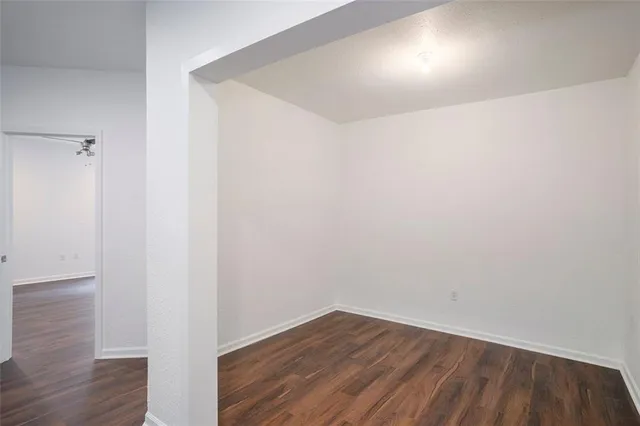 a view of room with wooden floor