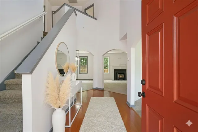 a view of an entryway with wooden floor