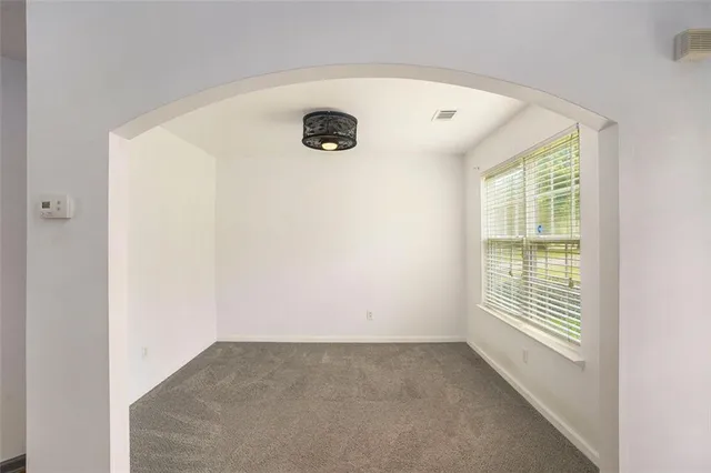 a view of a room with window and fireplace
