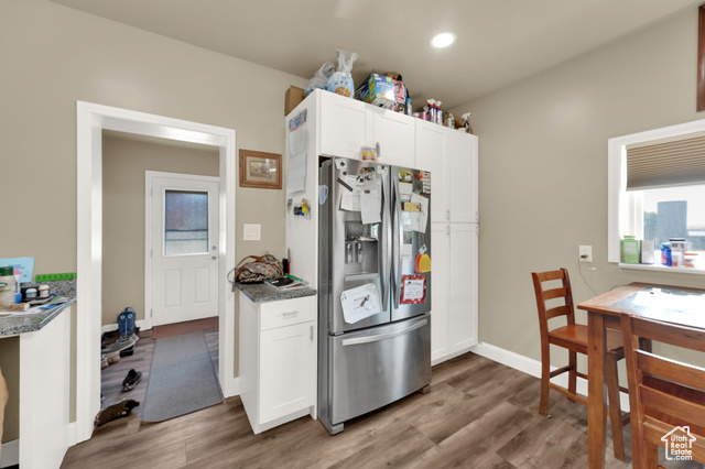 1632 South Main Street Springville, UT 84663 - Photo 5 of 93 Kitchen with stainless steel fridge with ice dispenser, wood finished floors, white cabinets, and recessed lighting