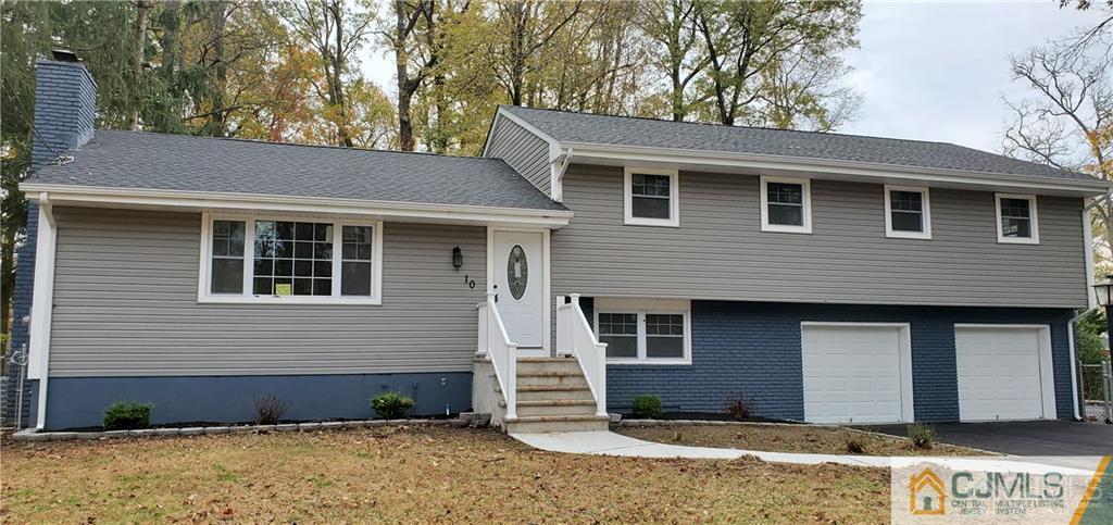 10 Huntington Road Edison, NJ 08820 - Photo 1 of 32 a front view of a house with a yard