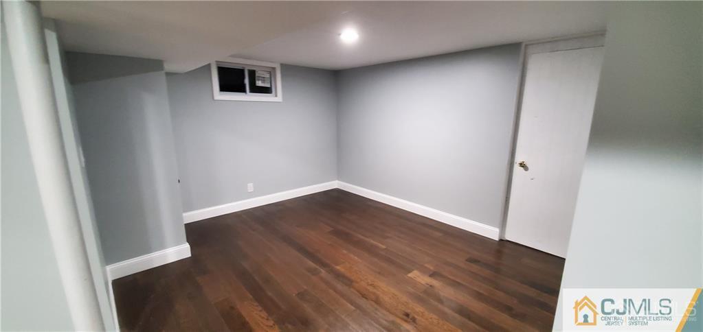 10 Huntington Road Edison, NJ 08820 - Photo 24 of 32 an empty room with wooden floor