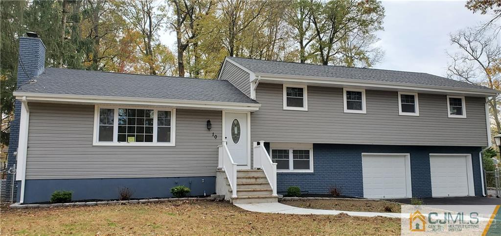 10 Huntington Road Edison, NJ 08820 - Photo 29 of 32 a front view of a house with a yard